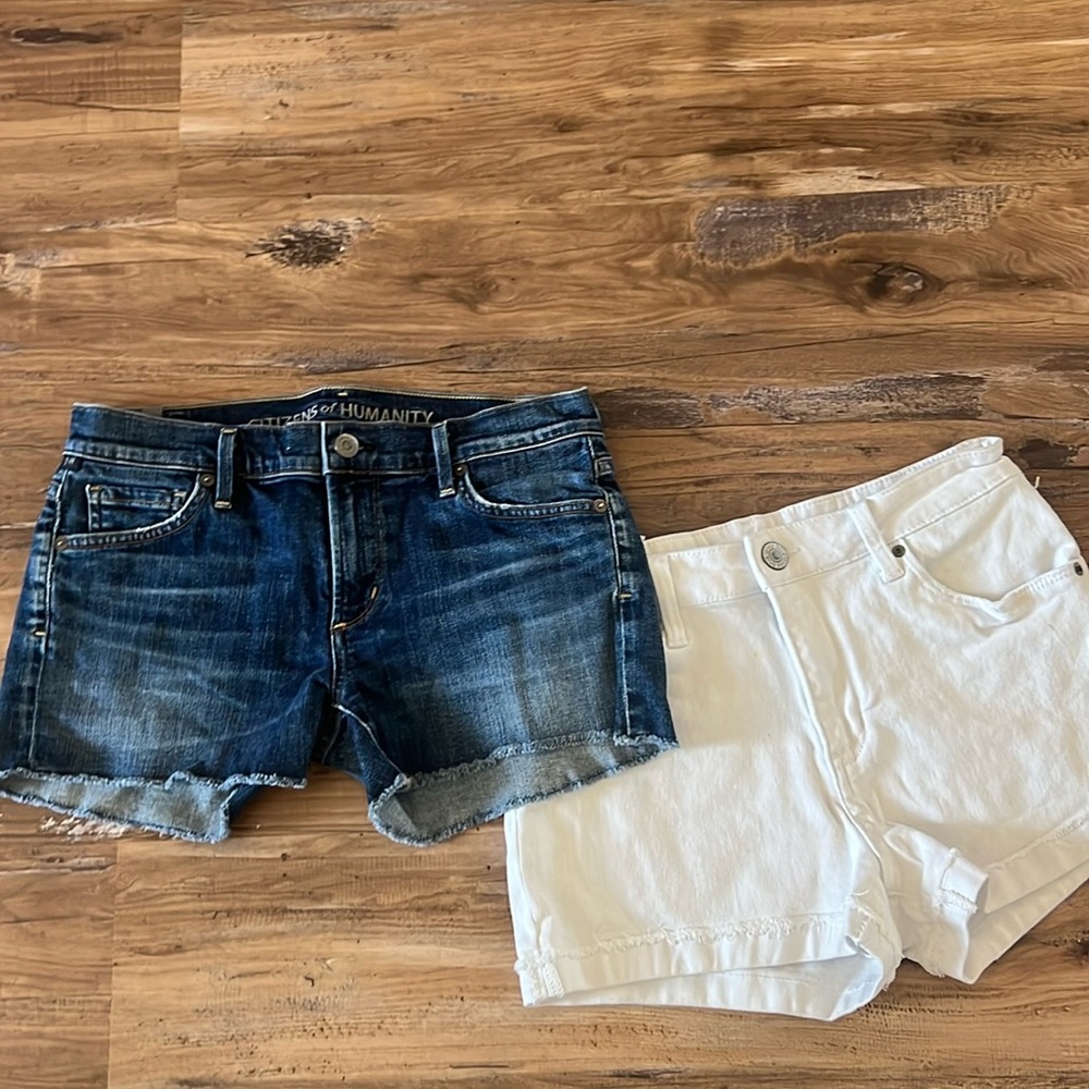 Pair of size 27 shorts. One white and one dark wash.